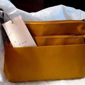 Travel bag, cosmetic bag. Brown/bronze. New Day brand.